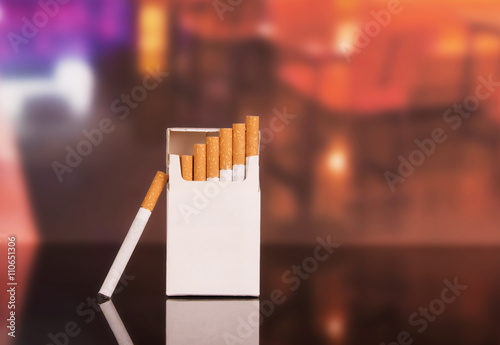 Konstfotografi Opened pack of cigarettes close-up on  background  the restaurant