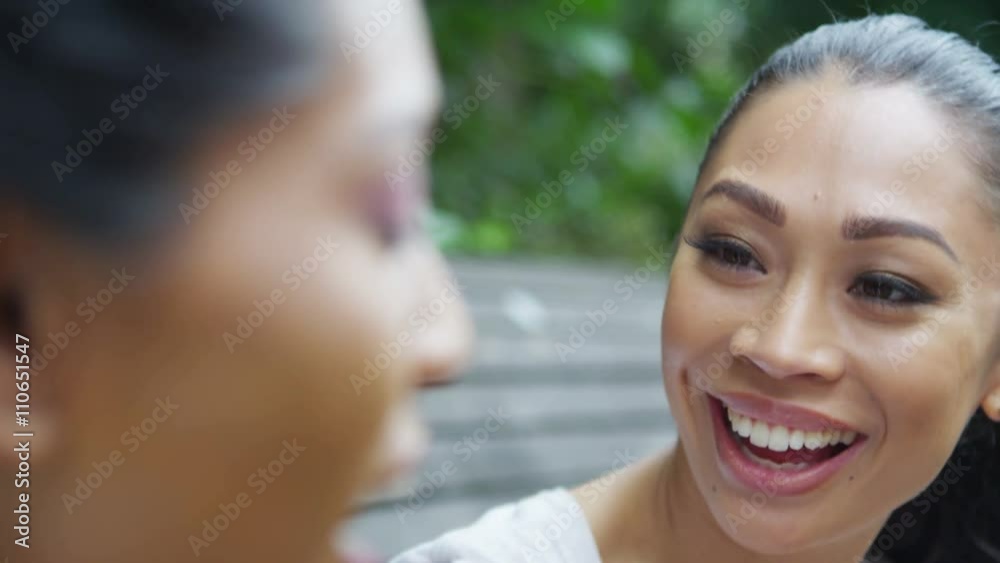 Close up portrait 2 beautiful female friends chatting outdoors in the city Close up portrait 2 beautiful female friends chatting outdoors in the city