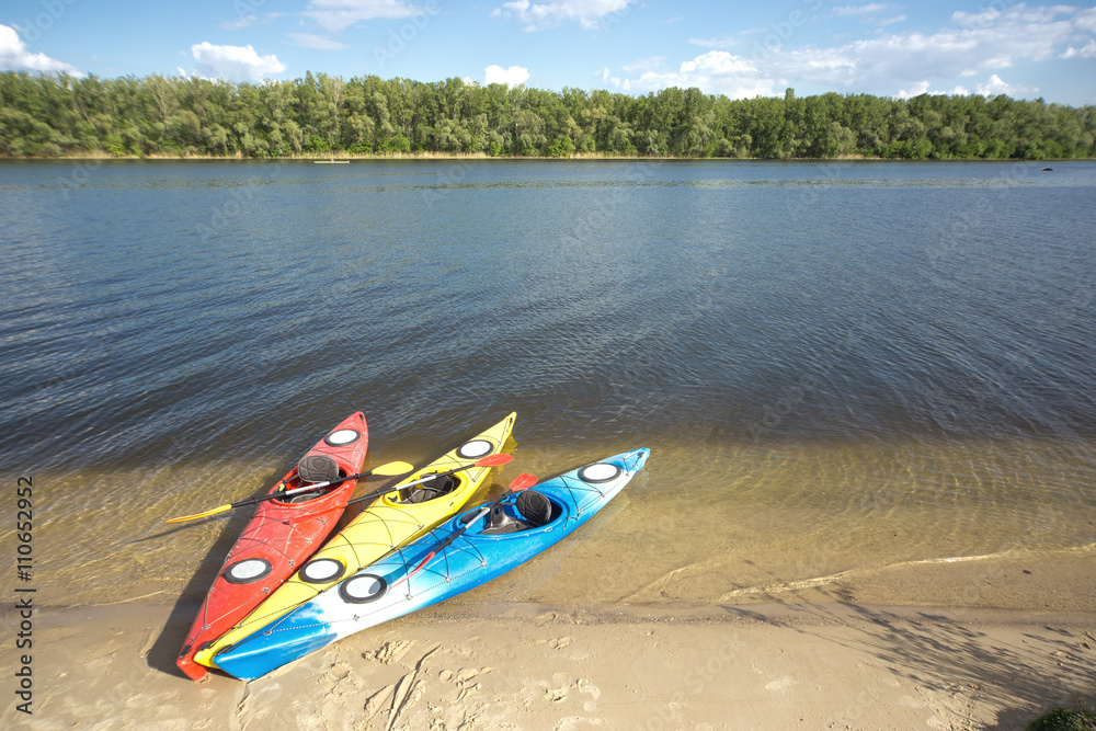 Camping with kayaks on the beach on a sunny day. Camping with kayaks on the beach on a sunny day.