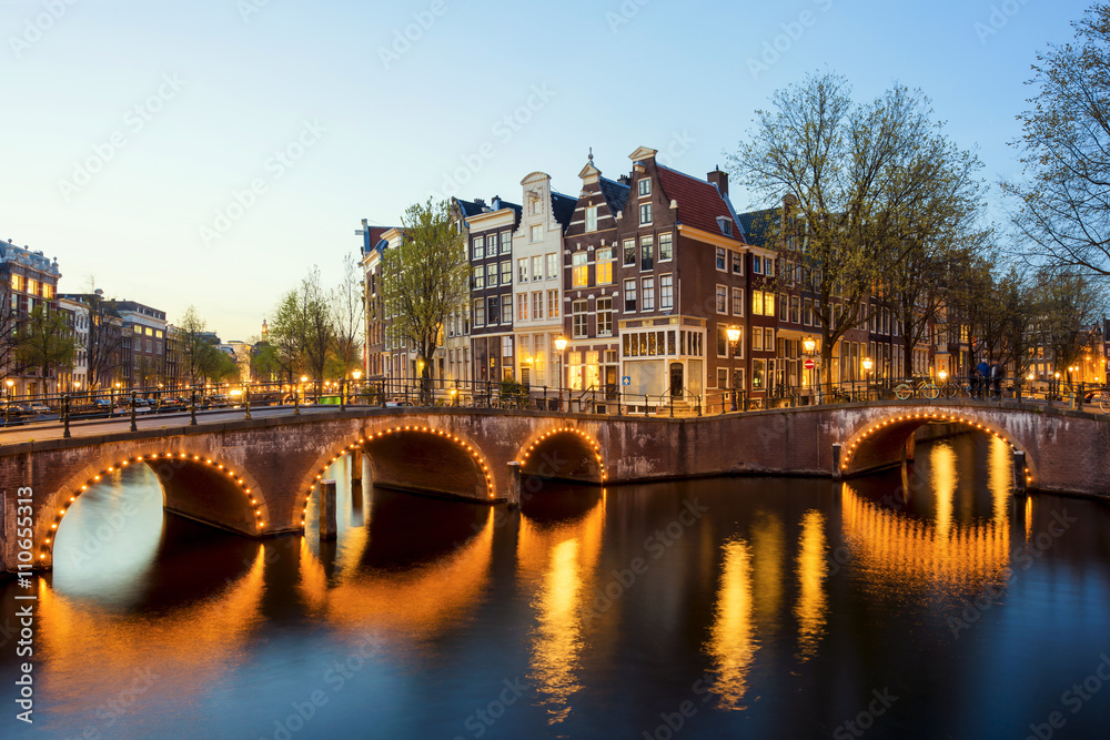 Wonderful view on houses of Amsterdam in night, Netherlands