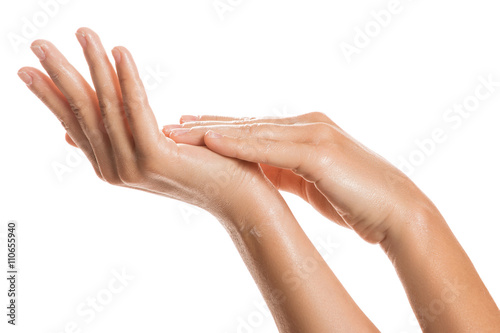 Female hands and moisturizing cream