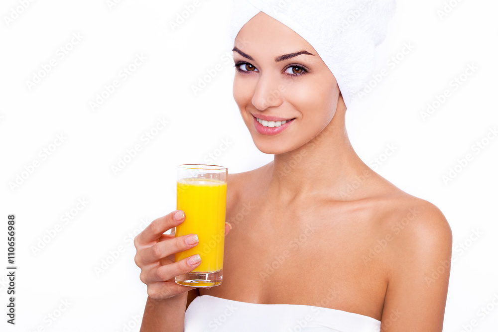 It's freshly squeezed! Studio portrait of an attractive young woman holding a glass of orange juice It's freshly squeezed! Studio portrait of an attractive young woman holding a glass of orange juice