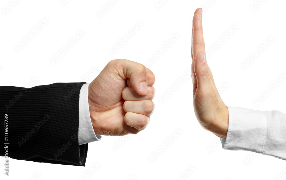 Woman hand stopping angry man fist, isolated on white Woman hand stopping angry man fist, isolated on white