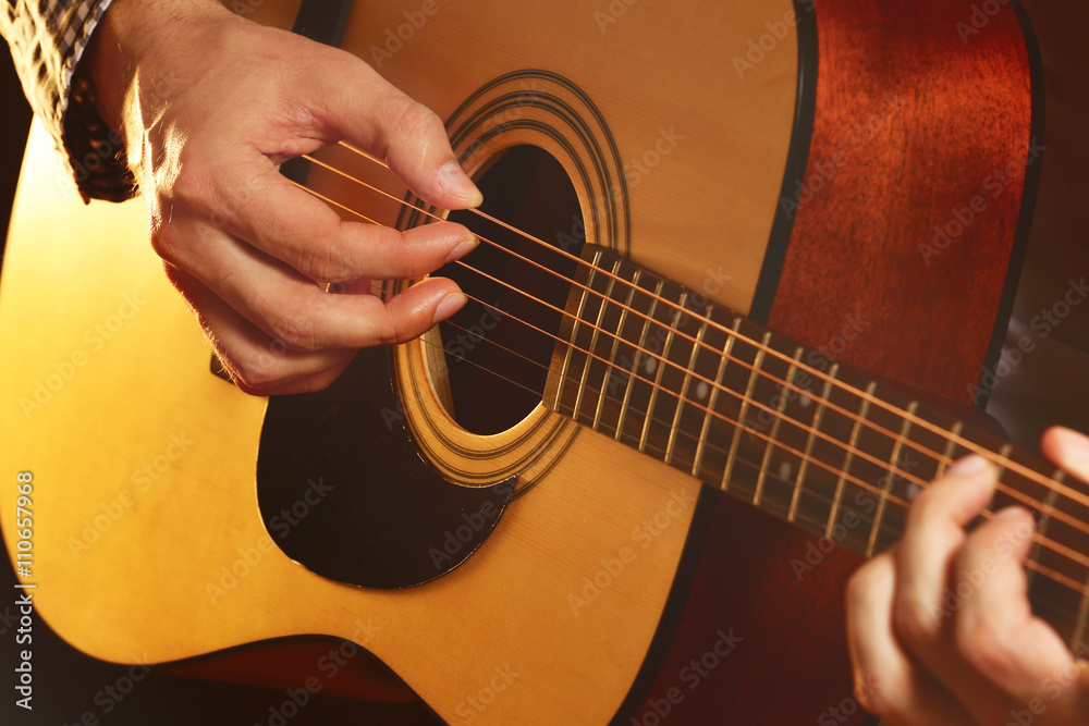 Fototapeta premium Man playing acoustic guitar