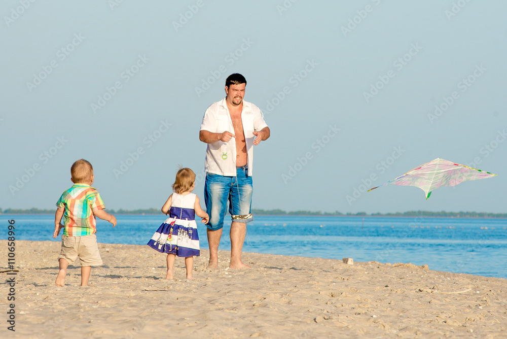 Happy family launching a kite.