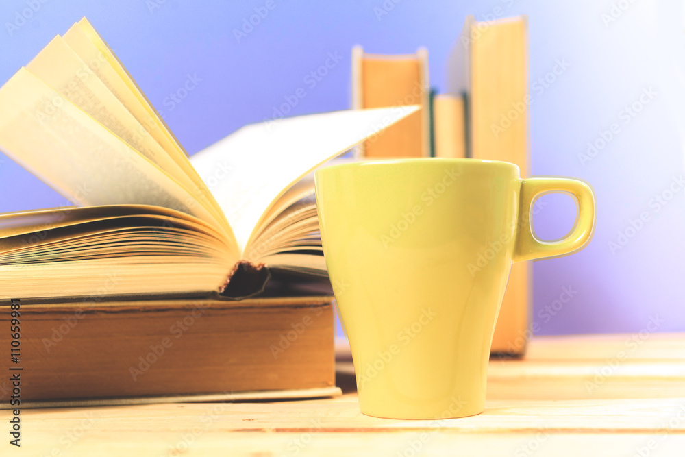 Color cup of tea with books on table Color cup of tea with books on table