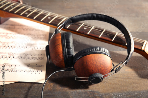 Guitar and headphones on wo...