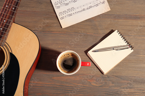 Guitar with notebook and cu...