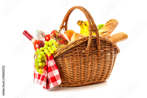 picnic basket with fruit bread and wine