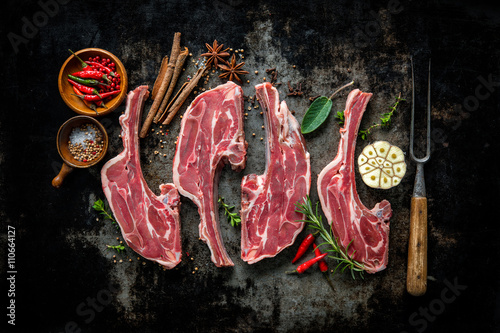 Raw fresh lamb meat on dark background photo