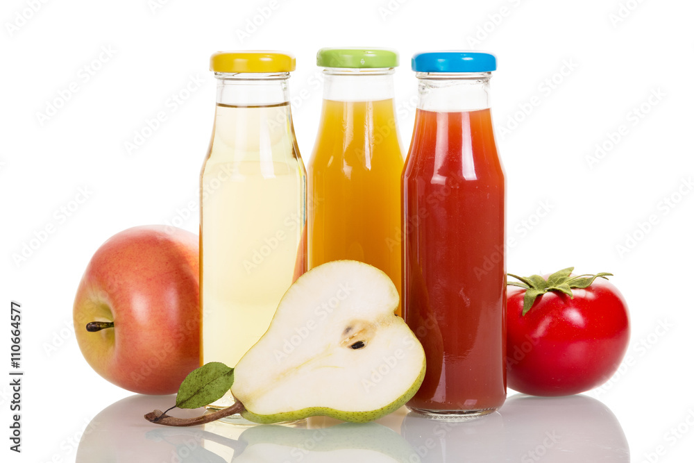 Bottles of fruit and vegetable juices isolated on white. Bottles of fruit and vegetable juices isolated on white.