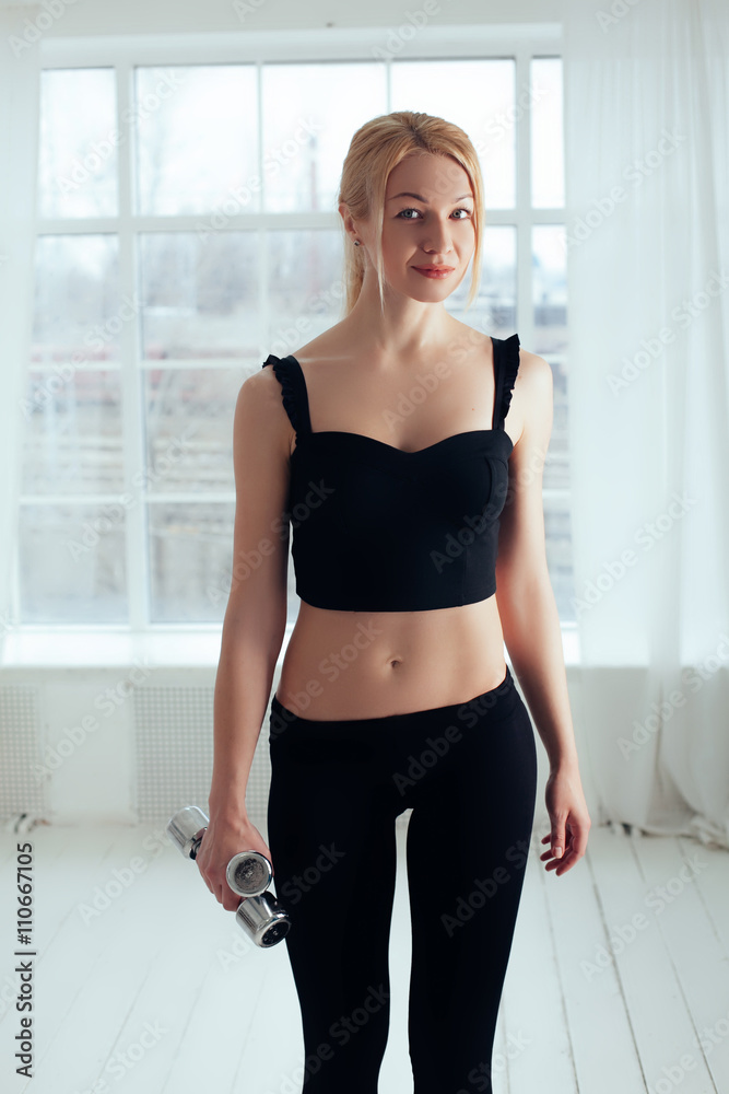 fitness woman working out with dumbbell.white background