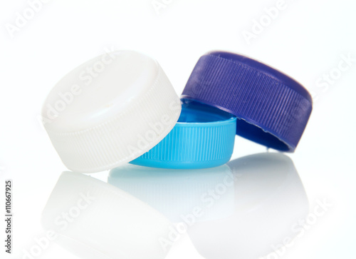 Multi-colored cover with plastic bottles isolated on white.