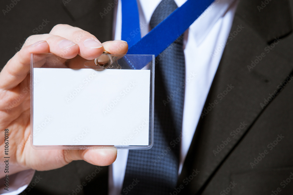 Businessman showing an empty badge Businessman showing an empty badge