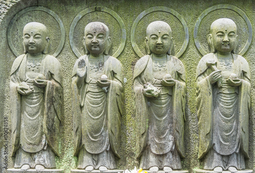 Close-up row of stone Jizo Bodhisattva statues in the Hase-dera temple in Kamakura, Japan.