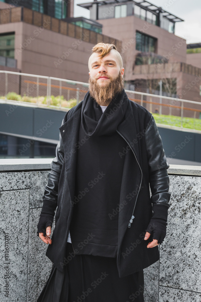 Stylish bearded man posing in the street Stylish bearded man posing in the street