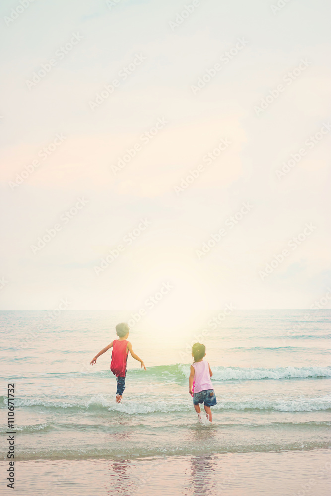 Fototapeta premium Children playing outdoors at the beach.