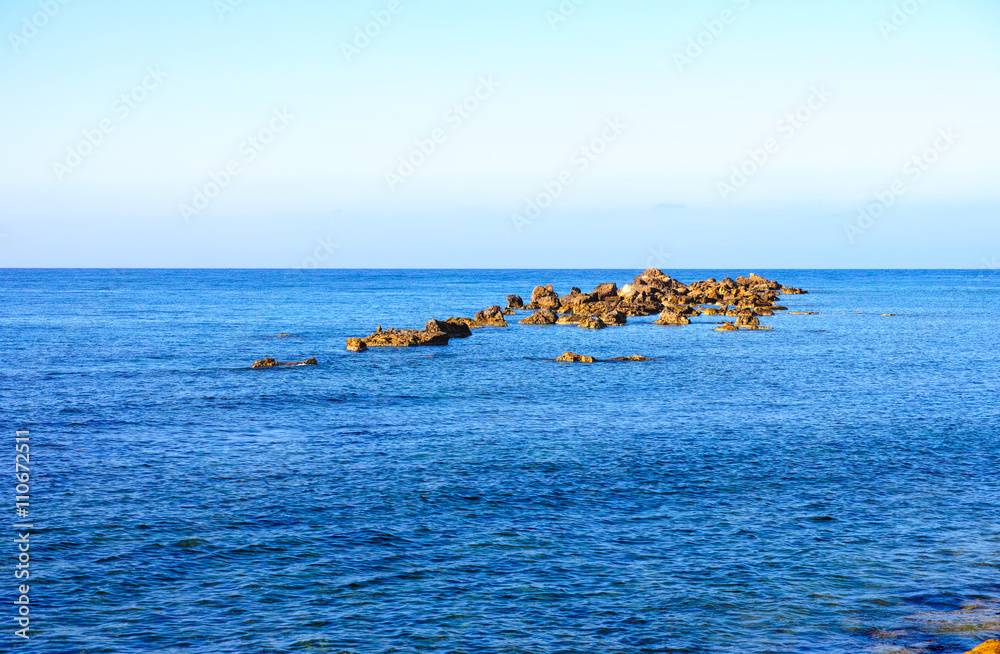 Sea with rocks and clean blue sky Sea with rocks and clean blue sky