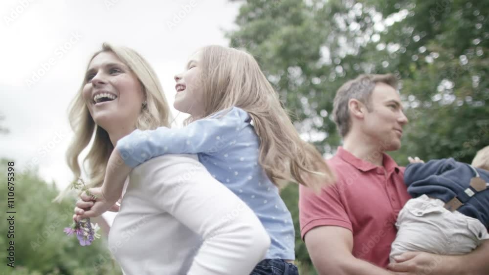 Portrait of happy affectionate family spending time together outdoors. Portrait of happy affectionate family spending time together outdoors.
