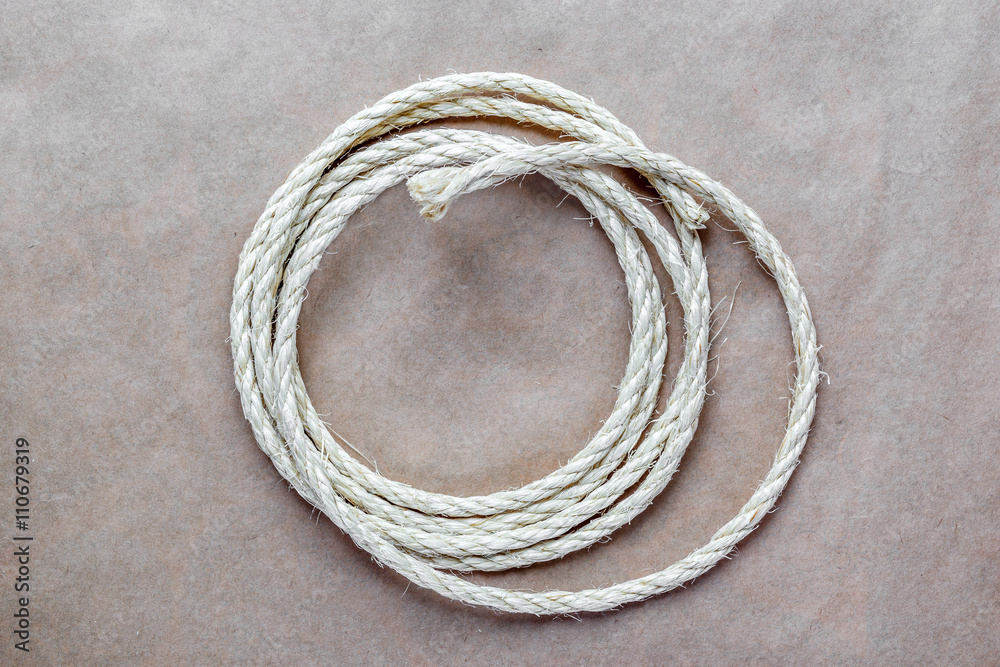 rope coiled at kraft paper on the background