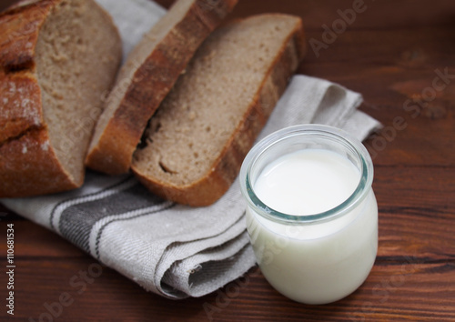 Home-made bread on wooden background