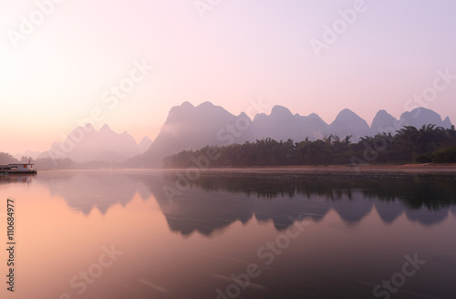 Sunrise at Li River, Xingping, Guilin, China. Xingping is a town in North Guangxi, China. It is 27 kilometers upstream from Yangshuo on the Li River photo