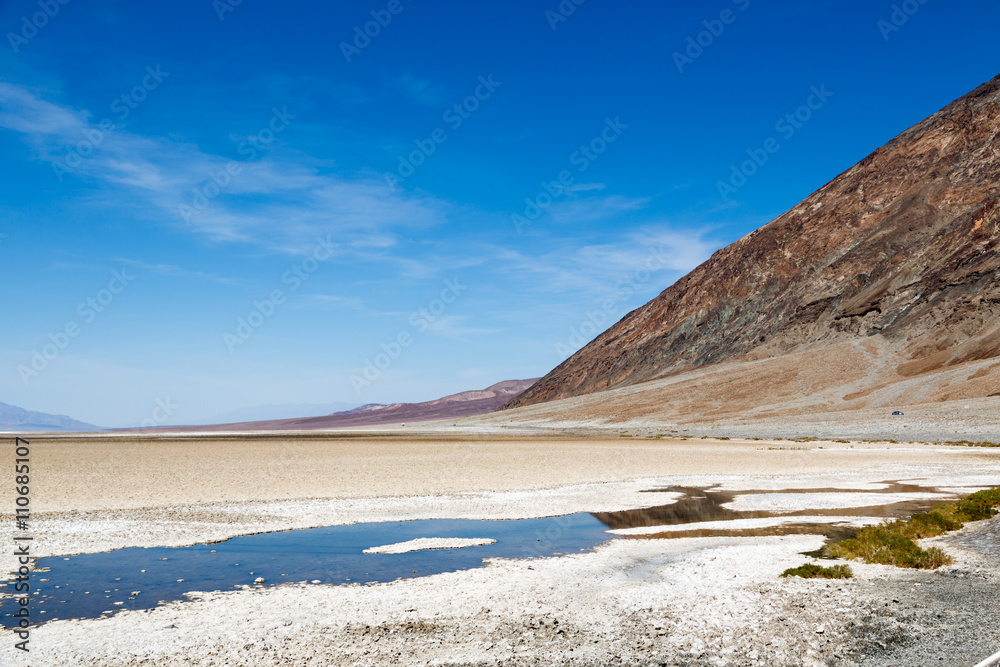 Beautiful scenario, sand formations in the foreground, blue sky day at the Death Valley National Park, Arizona, USA Beautiful scenario, sand formations in the foreground, blue sky day at the Death Valley National Park, Arizona, USA