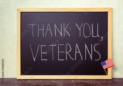 handwriting text thank you veterans is written in chalkboard wit