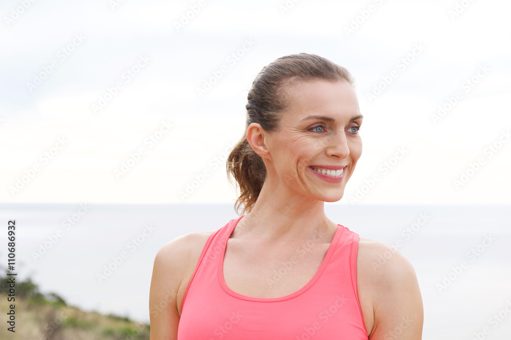 Close up portrait of sport woman smiling outdoors Close up portrait of sport woman smiling outdoors