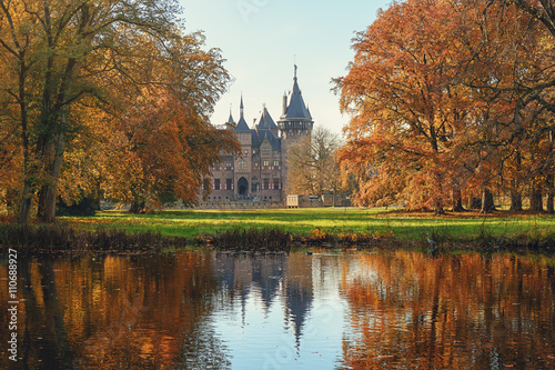 Old castle in a fairy autumn park.