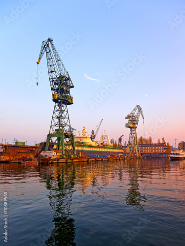  View of the industrial zone. Cranes, docks in shipyard.