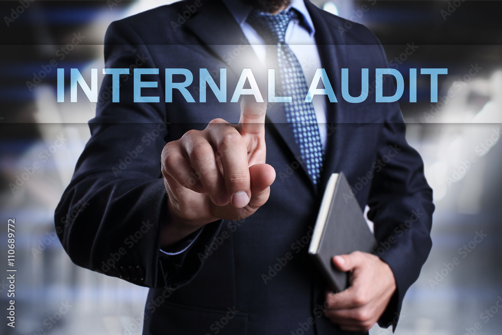 Businessman is pressing on virtual screen and selecting Internal audit. Businessman is pressing on virtual screen and selecting Internal audit.