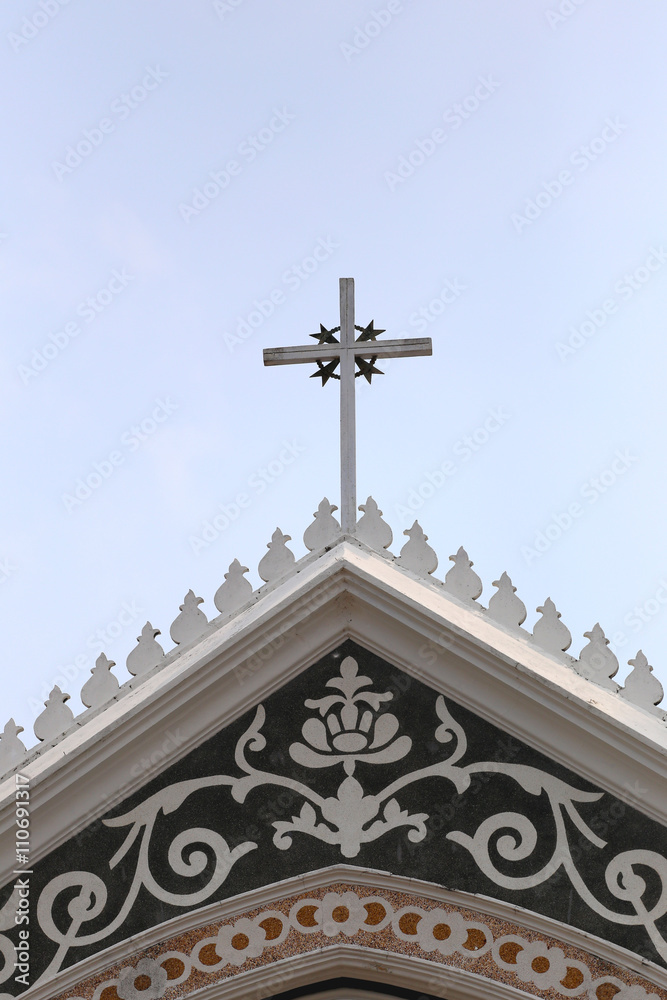 crucifix on roof architecture of the church on clear day.