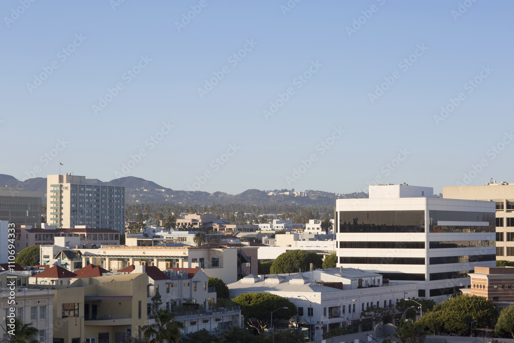 House on a background of mountain range. City, mountain and blue sky in USA, Santa Monica. 