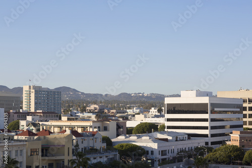 House on a background of mountain range. City, mountain and blue sky in USA, Santa Monica. 