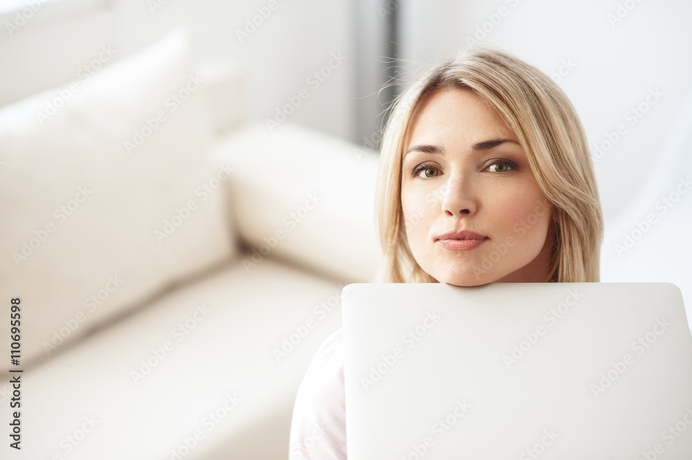 Pretty young woman is making fun with computer Pretty young woman is making fun with computer