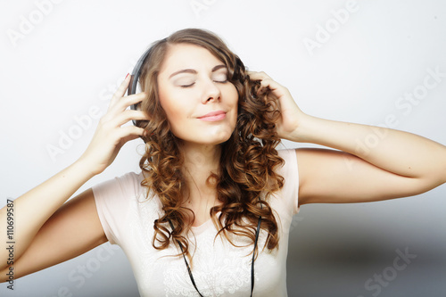 Woman with headphones listening music