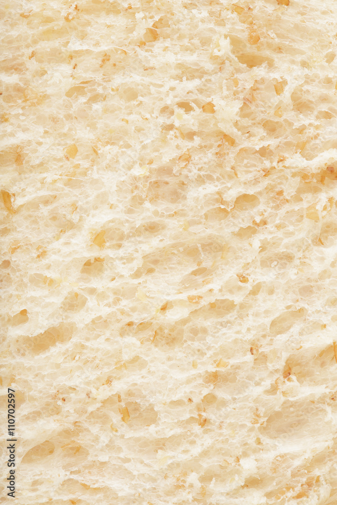 White whole wheat bread slice close up texture background
