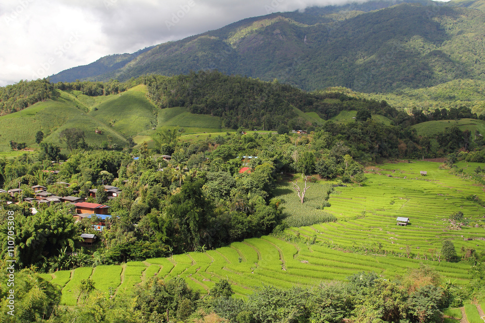 Beautiful landscape with light and shadow of the rice terraces(paddy field) and mountains at Mae-Jam Village , Chaingmai Province in Thailand