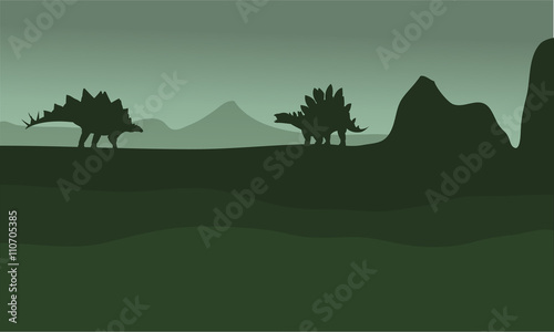 stegosaurus in fields scenery silhouette