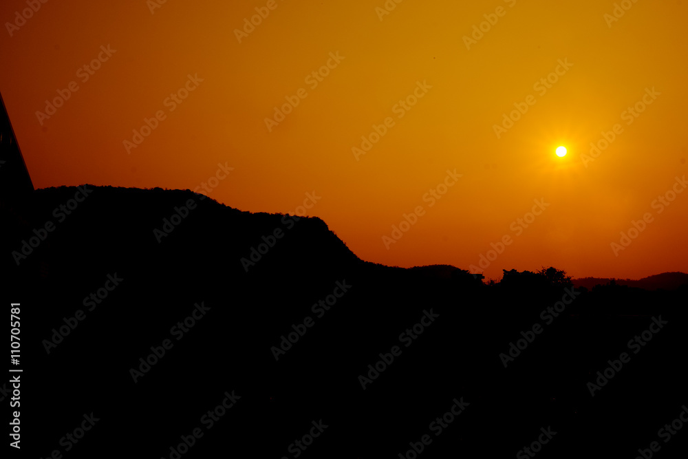 Sun setting over hills Sun setting over hills