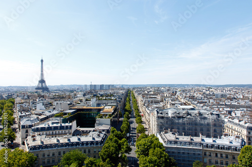Color DSLR wide angle image of the landmark, tourist destination Eiffel Tower, Paris, France, with the skyline of Paris in the foreground and background. Horizontal with copy space for text