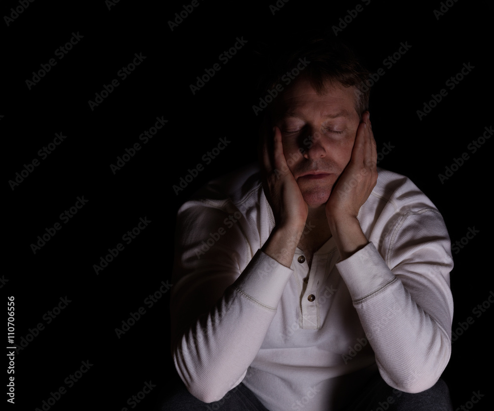 Tired man showing depression in dark background Tired man showing depression in dark background