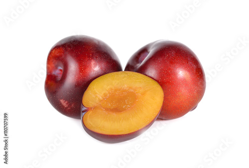ripe ruby plum fruit on white background