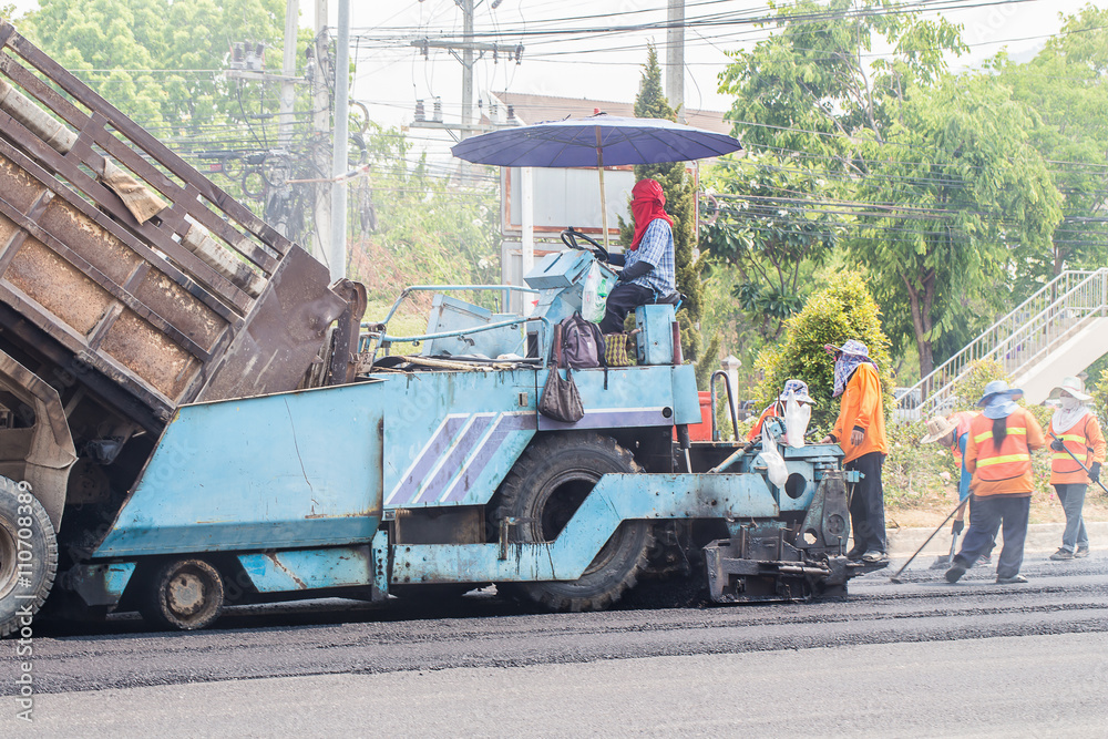 tracked paver at asphalt pavement works for road