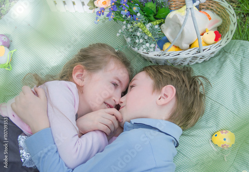 Brother and sister lying nose to nose
