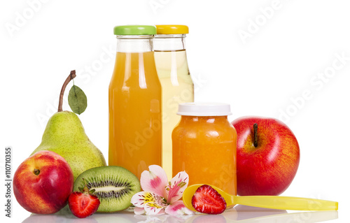 Baby food, puree and fruit juices in glass bottles isolated.