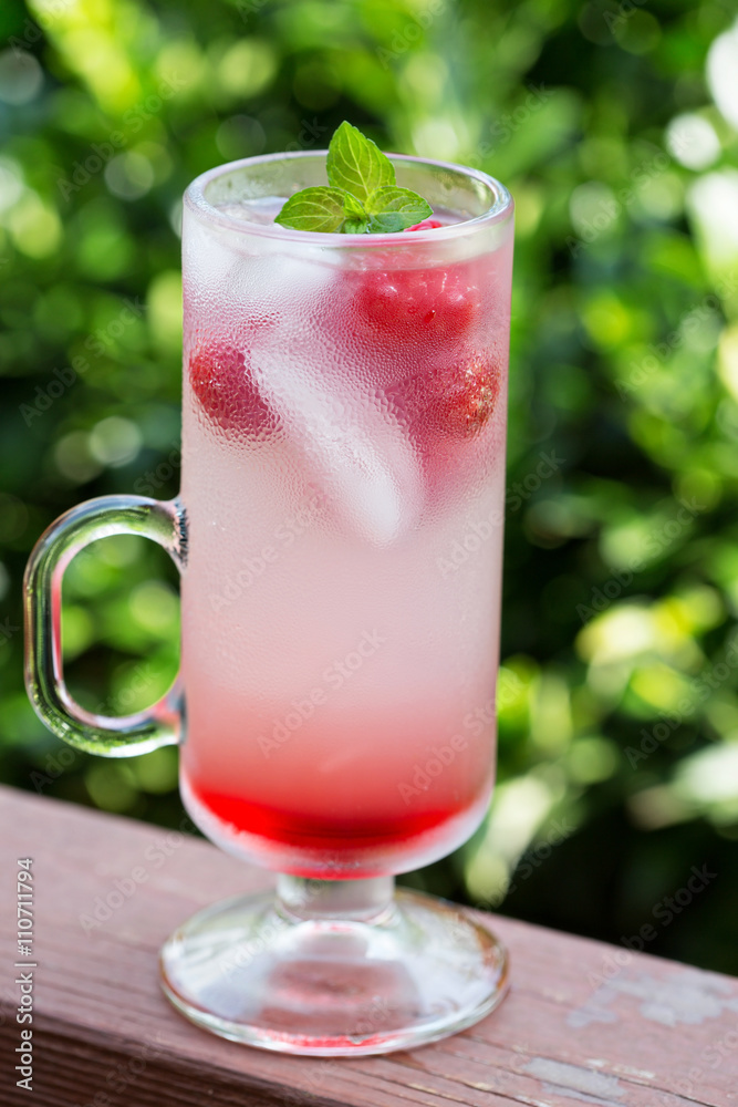 Pink raspberry lemonade in tall glasses Pink raspberry lemonade in tall glasses