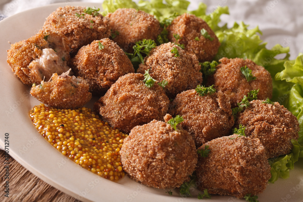 Dutch meat croquettes Bitterballen and mustard close up. Horizontal
Dutch meat croquettes Bitterballen and mustard close up. Horizontal