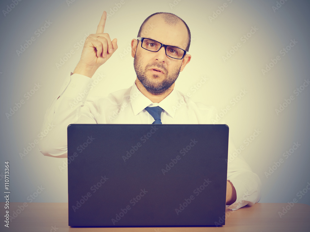 Portrait of businessman pointing finger up Portrait of businessman pointing finger up